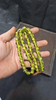Greenish tint small yellow smiley faces venetian inspired beads strand