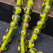 Greenish tint small yellow smiley faces venetian inspired beads strand