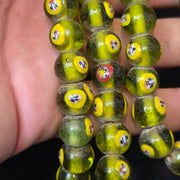 Greenish tint small yellow smiley faces venetian inspired beads strand