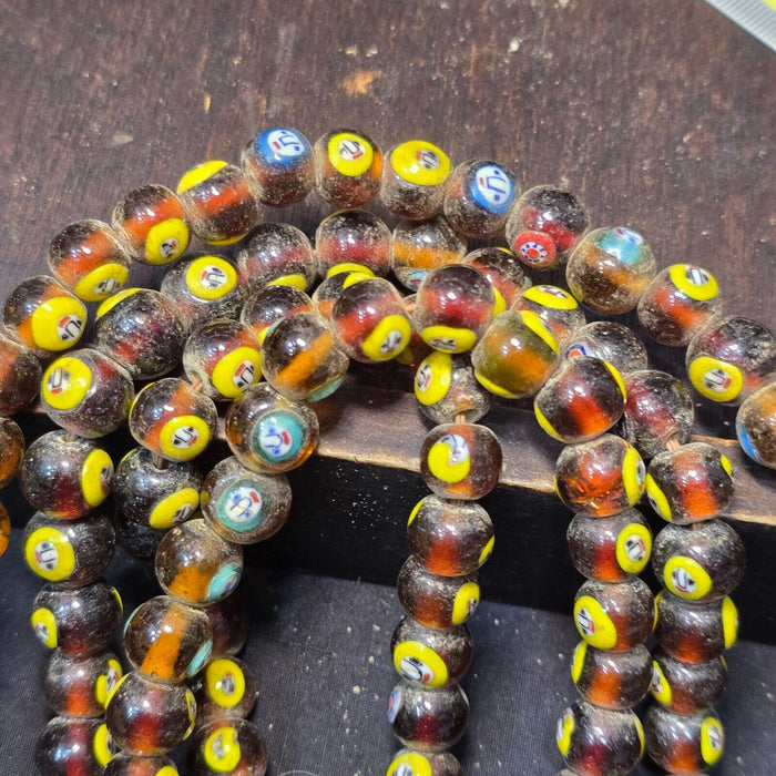 Brown tint small yellow smiley faces venetian inspired beads strand