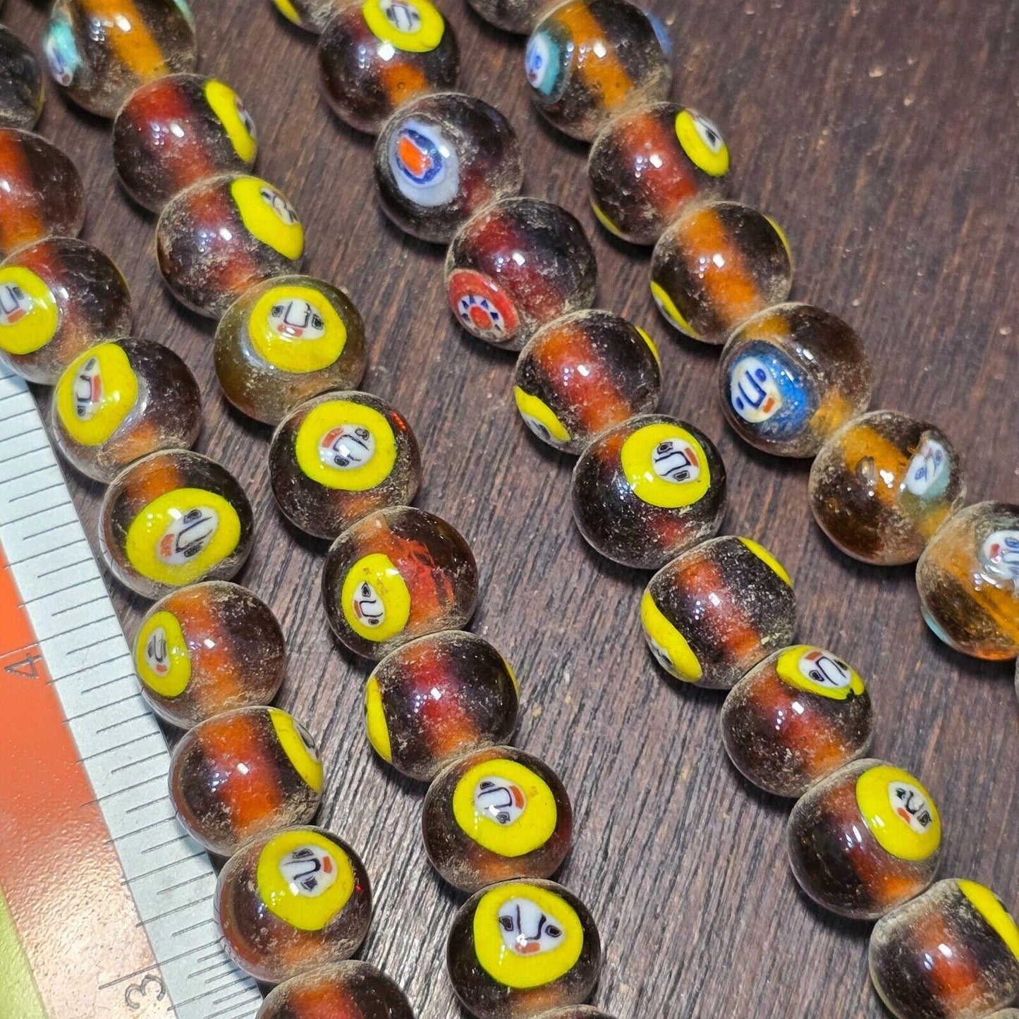 Brown tint small yellow smiley faces venetian inspired beads strand