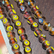 Brown tint small yellow smiley faces venetian inspired beads strand
