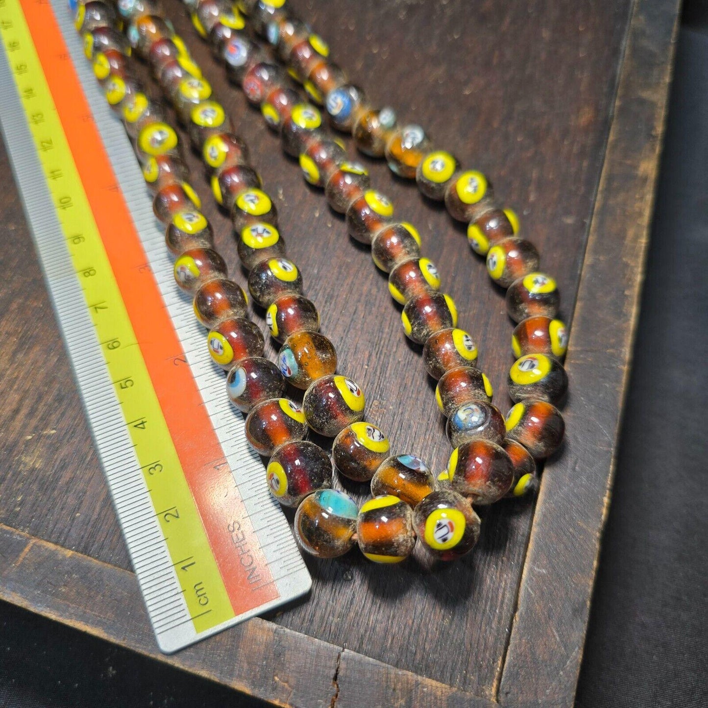 Brown tint small yellow smiley faces venetian inspired beads strand