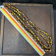 Brown tint small yellow smiley faces venetian inspired beads strand