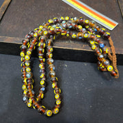Brown tint small yellow smiley faces venetian inspired beads strand