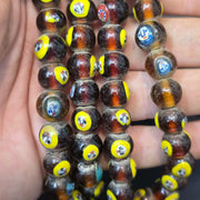 Brown tint small yellow smiley faces venetian inspired beads strand