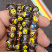 Brown tint small yellow smiley faces venetian inspired beads strand