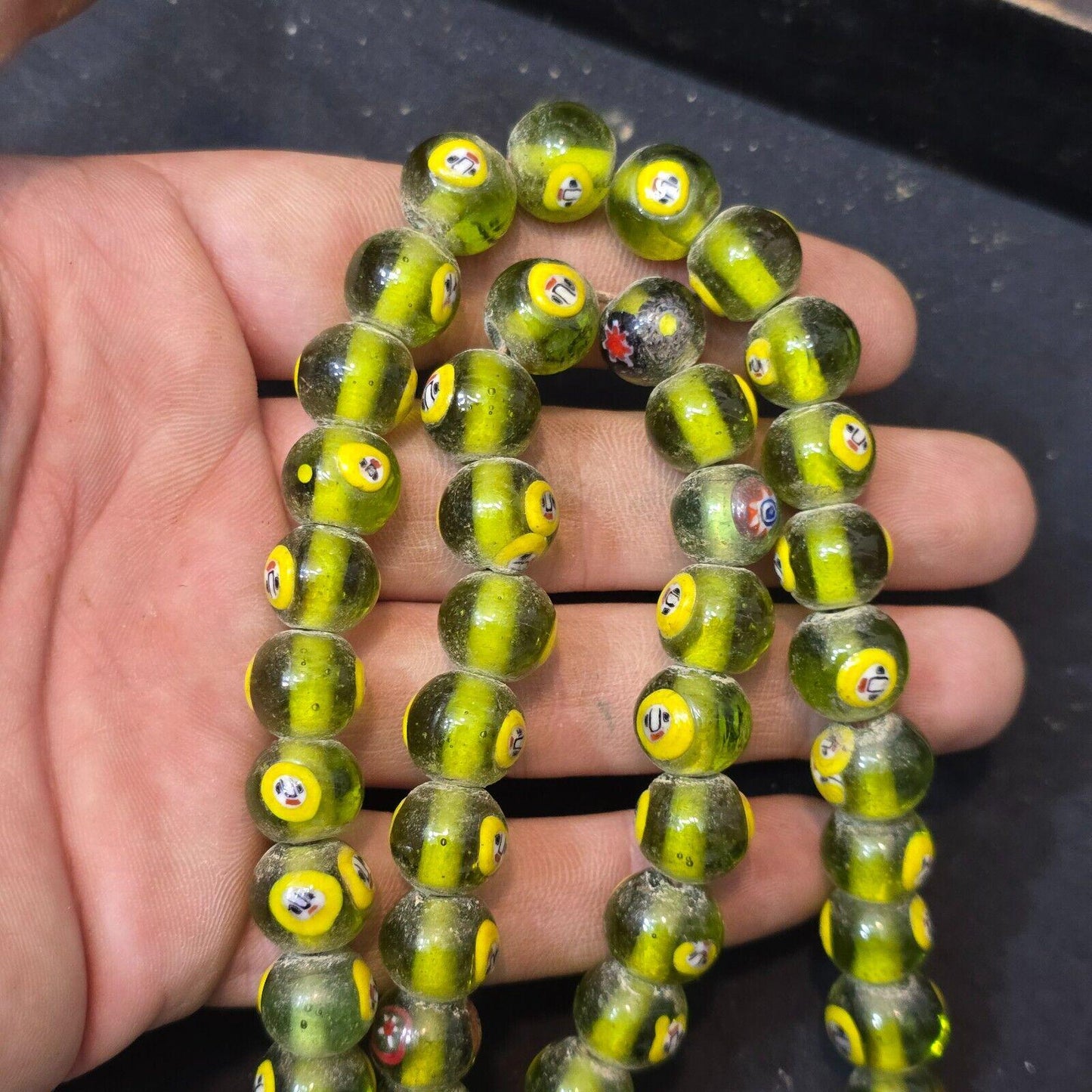 Greenish tint small yellow smiley faces venetian inspired beads strand
