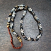 Vintage fancy feather venetian style glass and tibetan bone beads necklace.