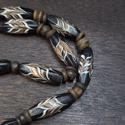 Vintage fancy feather venetian style glass and tibetan bone beads necklace.