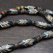 Vintage fancy feather venetian style glass and tibetan bone beads necklace.
