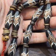 Vintage fancy feather venetian style glass and tibetan bone beads necklace.