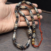 Vintage fancy feather venetian style glass and tibetan bone beads necklace.
