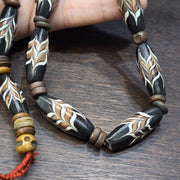 Vintage fancy feather venetian style glass and tibetan bone beads necklace.
