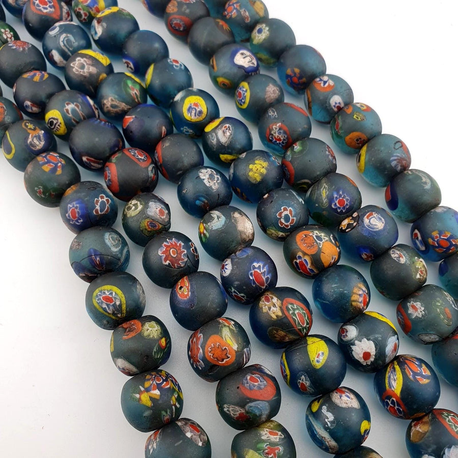 Vintage light blue yellow eyes face african glass beaded necklace .