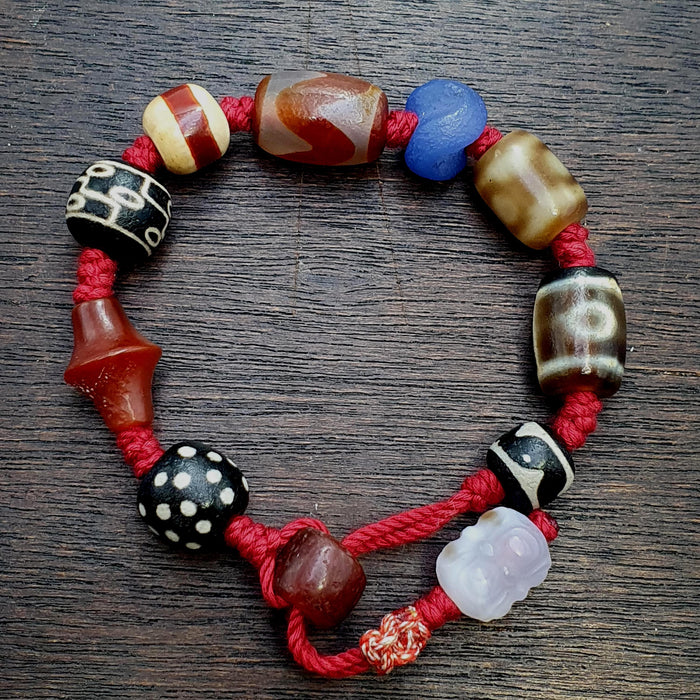 Vintage agate beads bracelet red cord, cultural motifs, tibetan dzi beads