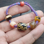 Handmade 9 eyes dzi bead bracelet multicolor cord - spiritual beads bracelet