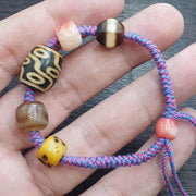 Handmade 9 eyes dzi bead bracelet multicolor cord - spiritual beads bracelet
