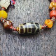 Handmade 2 eyes dzi bead bracelet multicolor cord - spiritual beads bracelet