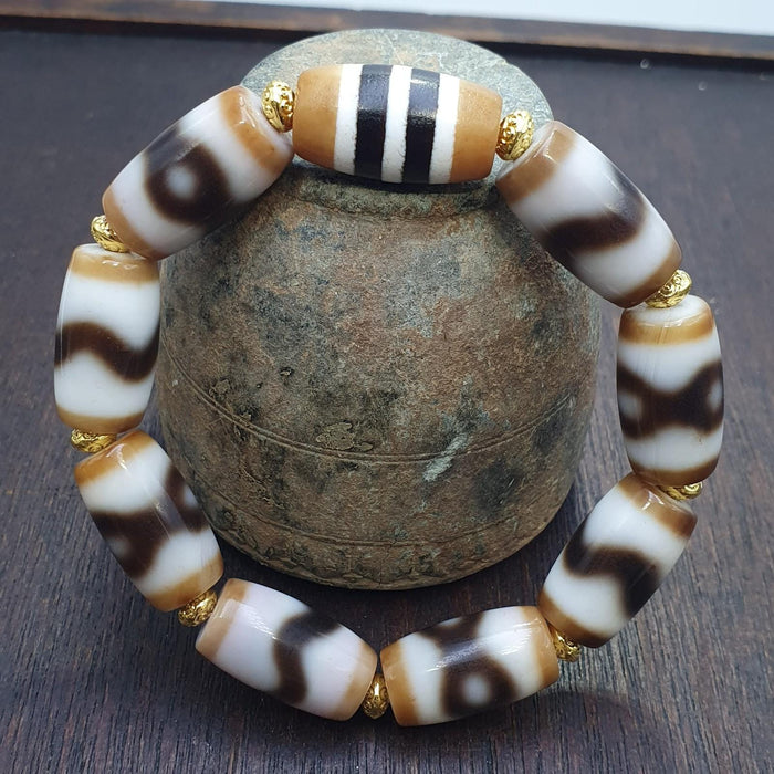 Tibetan nepalese dzi beads bracelet handmade cylindrical beads, gold spacers