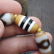Tibetan nepalese dzi beads bracelet handmade cylindrical beads, gold spacers
