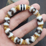Tibetan nepalese dzi beads bracelet handmade cylindrical beads, gold spacers