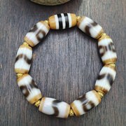Tibetan nepalese dzi beads bracelet handmade cylindrical beads, gold spacers