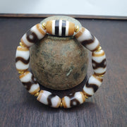 Tibetan nepalese dzi beads bracelet handmade cylindrical beads, gold spacers