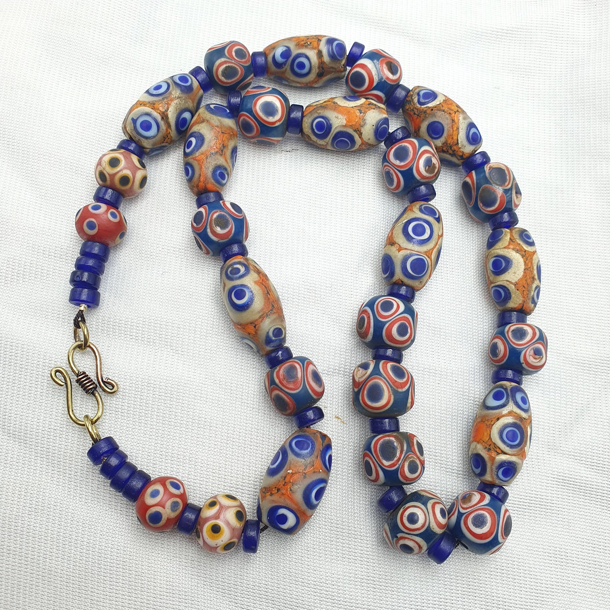 Hundred Eyes Skunk, Venetian Style Necklace | Glass Venetian Inspired Beads | 10mm Diameter, 22 Inches, Red Eye Accents