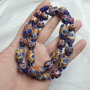 Hundred Eyes Skunk, Venetian Style Necklace | Glass Venetian Inspired Beads | 10mm Diameter, 22 Inches, Red Eye Accents