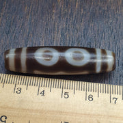 Tibetan-style 3 eye dzi bead in weathered banded agate – photo 2 of 5