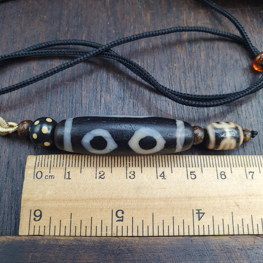 Tibetan-style 3 eye dzi bead with rustic dragon skin weathering – photo 1 of 5