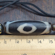Tibetan-style 3 eye dzi bead with rustic dragon skin weathering – photo 2 of 5