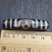 Tibetan-style 3 eye dzi bead in weathered banded agate – photo 1 of 5