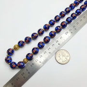 Murano Style Glass Bead Strand: Blue Aventurine Millefiori, 12mm shown beside a metric ruler and a US quarter coin for scale