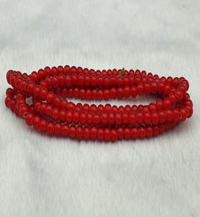 "Antique Venetian RED White Heart Trade Beads long strand necklace. A vibrant red and white heart-shaped bead necklace with intricate designs, strung on a long strand. The beads have a vintage, distressed appearance, adding to their antique charm."
