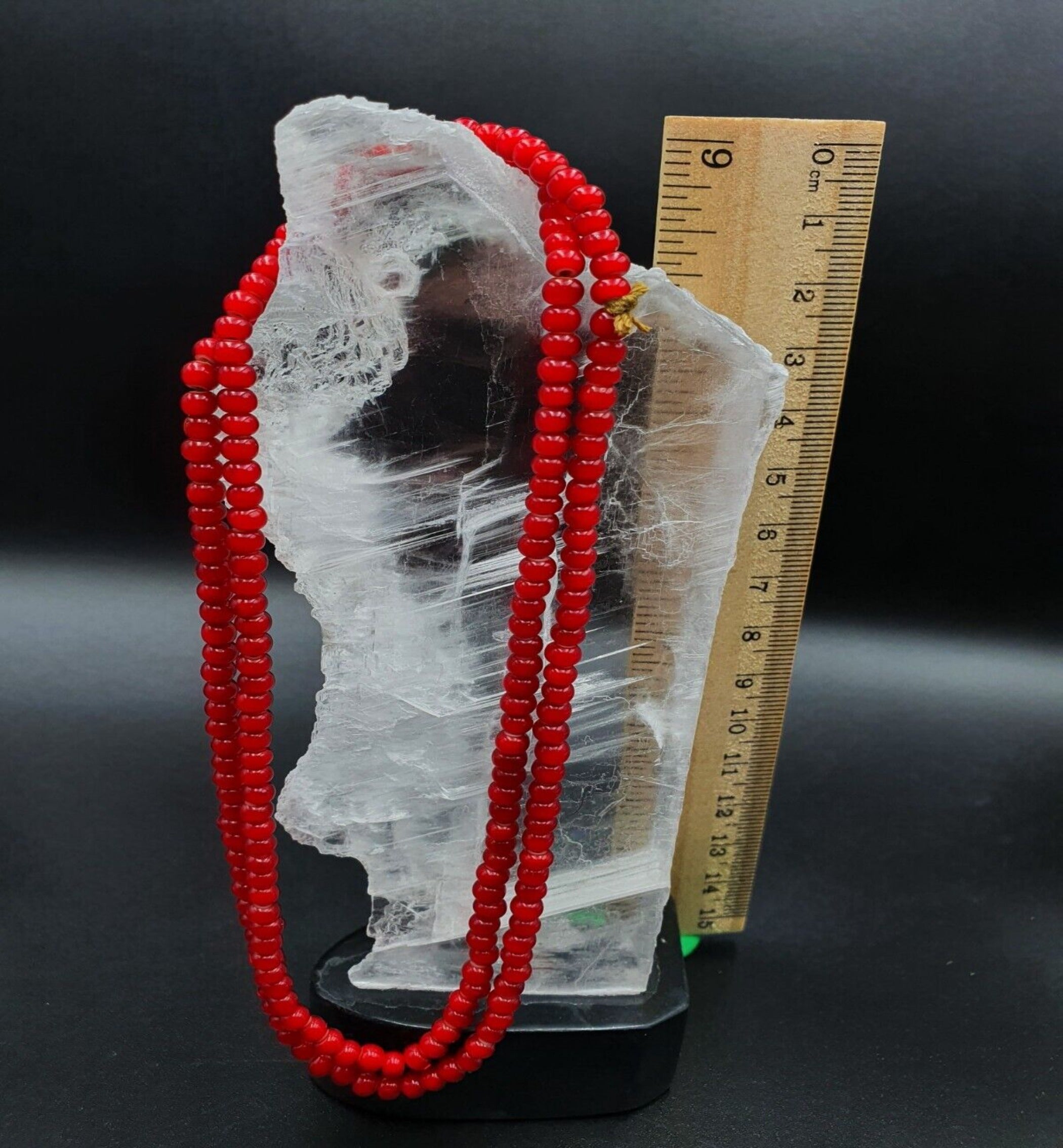 "Antique Venetian RED White Heart Trade Beads long strand necklace. A vibrant red and white heart-shaped bead necklace with intricate designs, strung on a long strand. The beads have a vintage, distressed appearance, adding to their antique charm."
