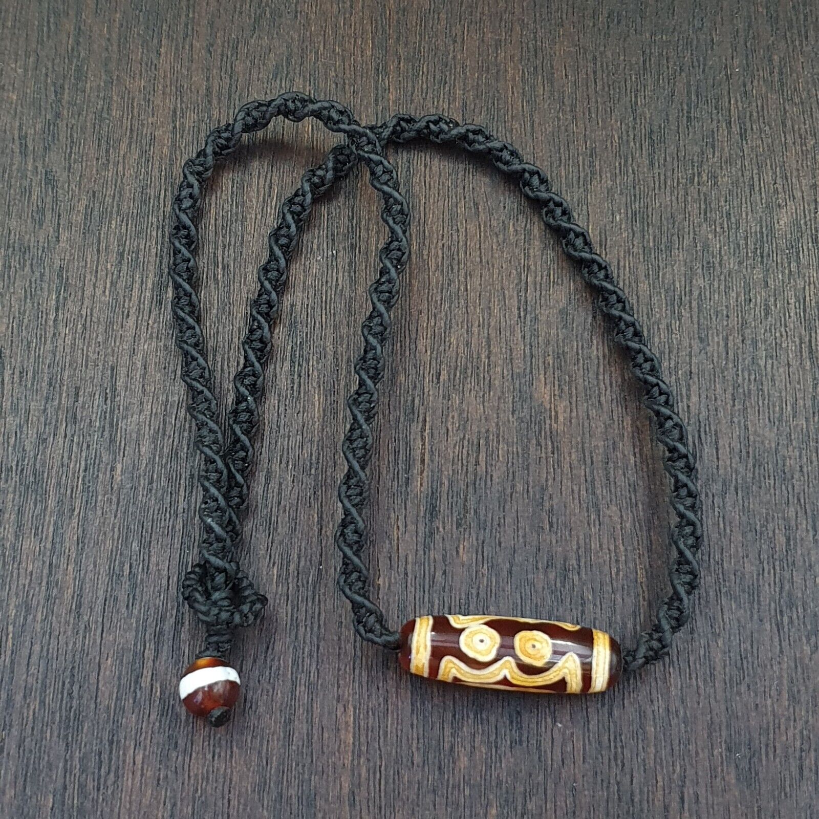 Antique Tibetan dzi beads and trade beads on a dealer's table