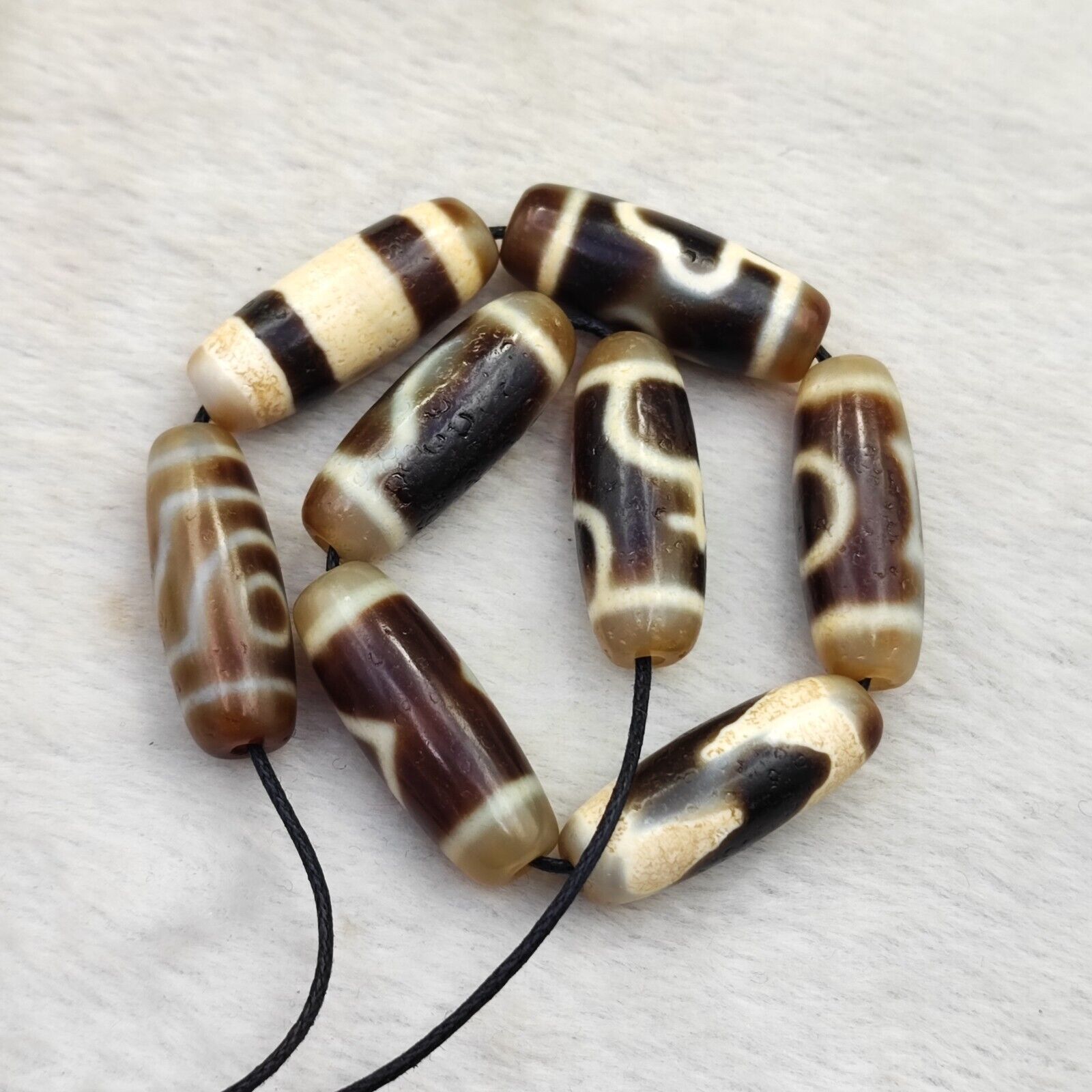 Lot 8 Sacred Treasures: Unveiling the Mystique of Tibetan Antique Dzi Beads