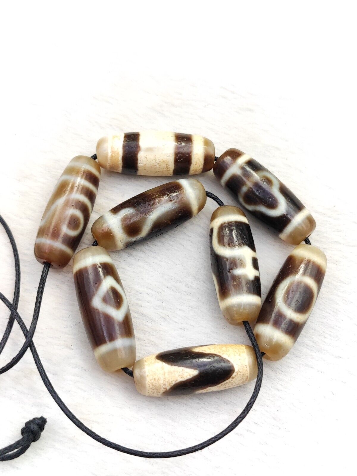 Lot 8 Sacred Treasures: Unveiling the Mystique of Tibetan Antique Dzi Beads