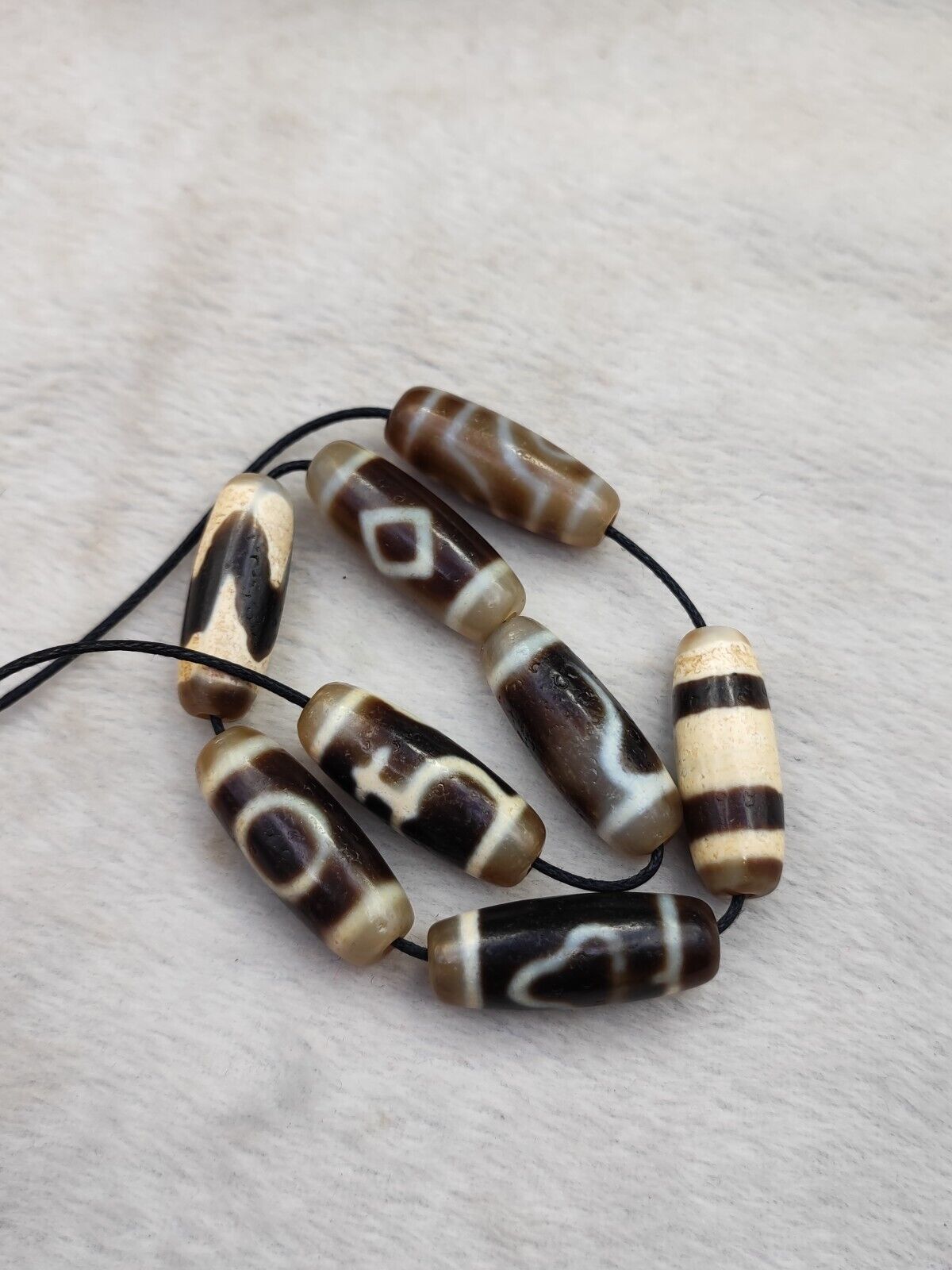 Lot 8 Sacred Treasures: Unveiling the Mystique of Tibetan Antique Dzi Beads